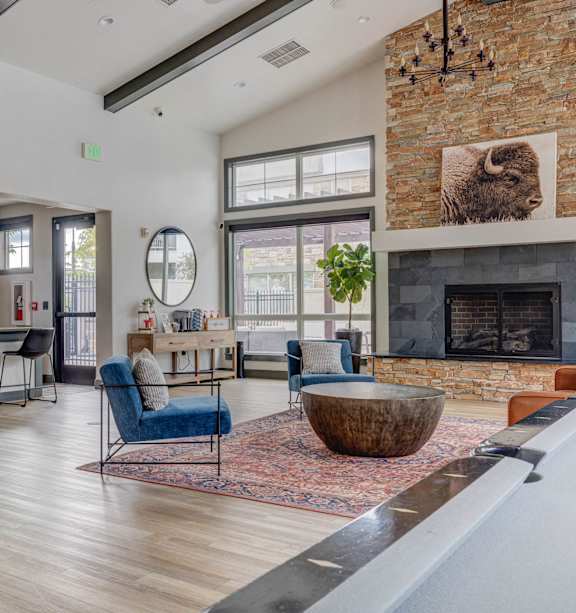 A living room with a fireplace and a pool table.