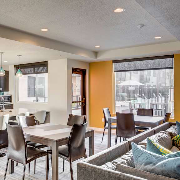A modern kitchen with a dining table and chairs. at The Zeller, Salt Lake City, UT, 84115