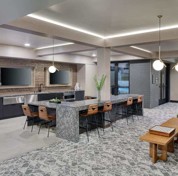 A modern conference room with a long table and chairs.