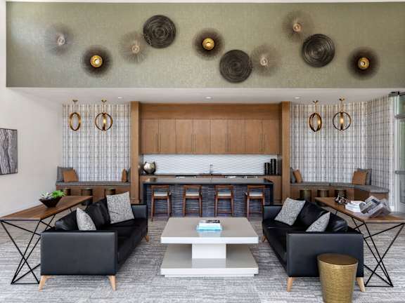 A modern living room with a wooden floor and a large flat screen TV.