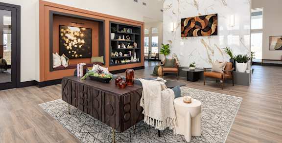 A rendering of a building with a parking lot in front at Montage at Hawk Ridge Apartments, Lake St. Louis, Missouri