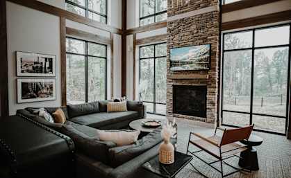 a living room with a leather couch and a fireplace at Preston Ridge, North Carolina, 28602