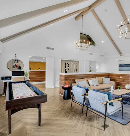 a living room with furniture and a pool table at AVIA Lofts on Liberty Ridge, Florida
