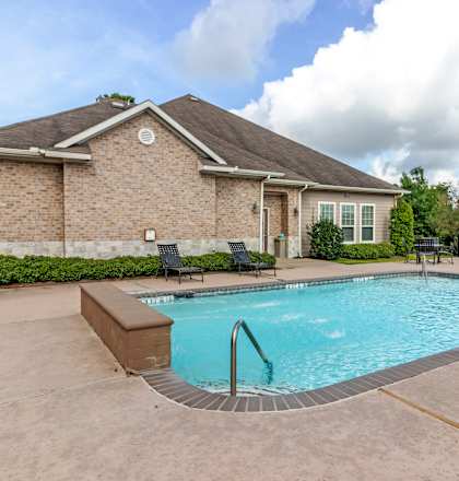 A house with a pool in the backyard.