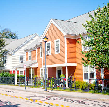 a row of houses on the side of a street