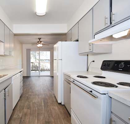 Birnam West: kitchen with white cabinets and white appliances