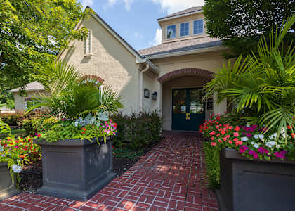 The main entrance of the Enclave at Town Center lobby, featuring a welcoming entryway and well-kept landscaping.