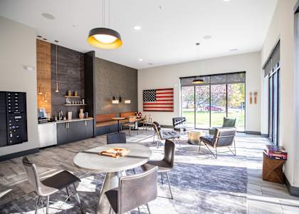 A modern dining room with a round table and chairs at Walnut View Apartments, Allentown, PA, 18102