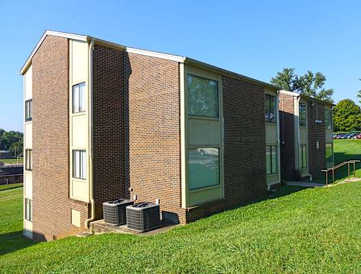 a row of modular housing units in a grassy area