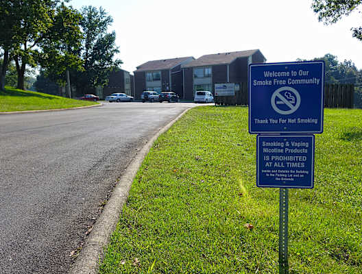 a sign in front of a building