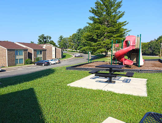 a playground at the whispering winds apartments in pearland, tx