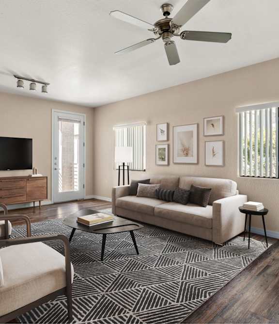 A living room with a couch, chair, and television.