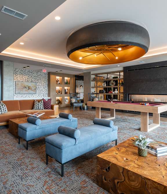 a living room filled with furniture and a large window