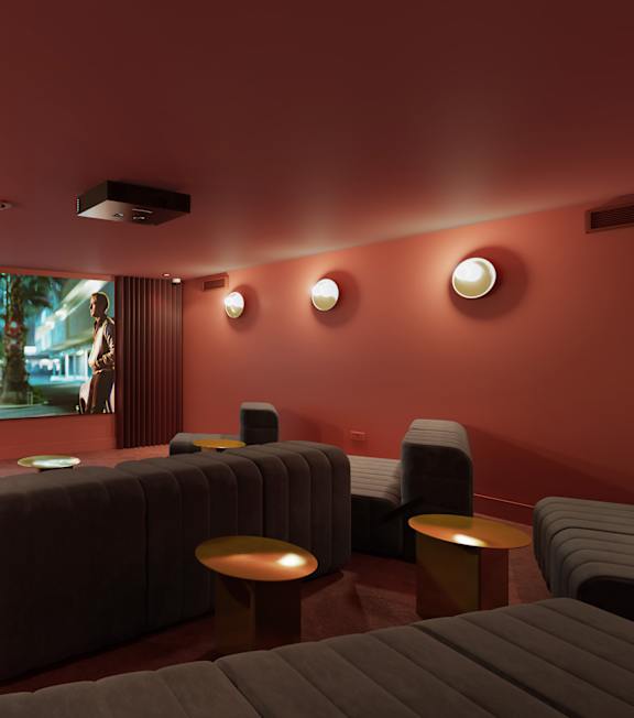 the lobby or reception area of a hotel with a couch