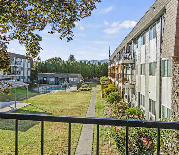 a view of the courtyard from a balcony of an apartment building