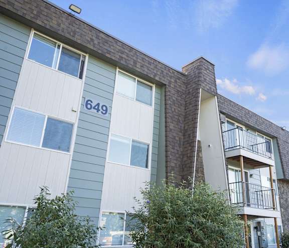 a view of a building with a blue sky in the background