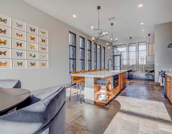 a large kitchen with a large island and a dining table