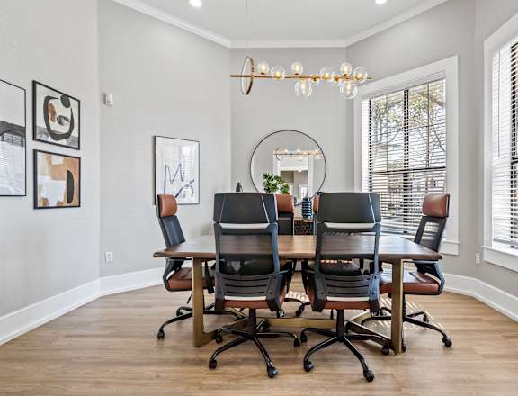 the dining room of a home with a table and chairs