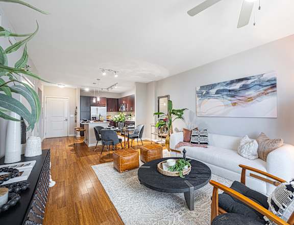 a living room and dining room with a couch and a table