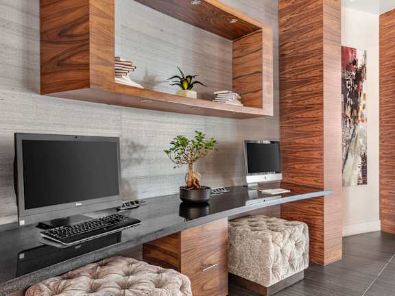 A modern workspace with a computer, keyboard, and mouse.