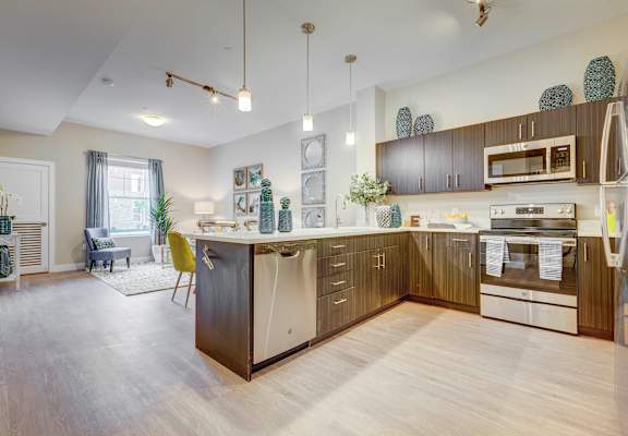 Living room and kitchen at Incline at Anthem senior apartments in Herriman