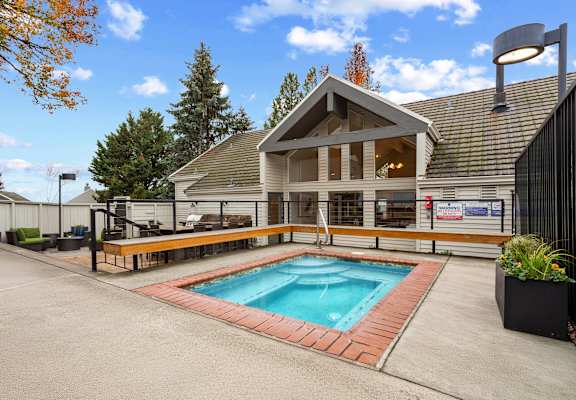 A house with a pool in the backyard.