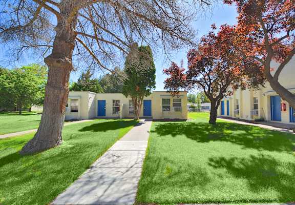 a sidewalk in front of a group of houses