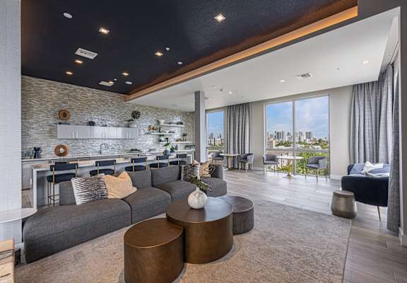 a living room with a gray couch and a table