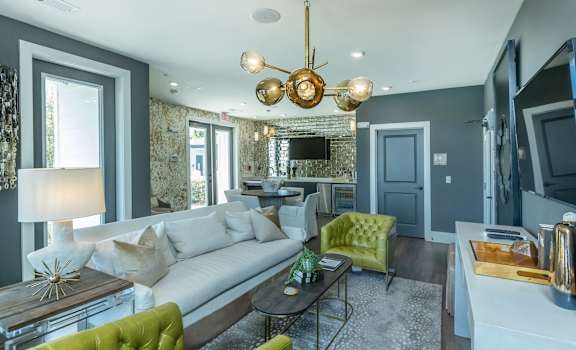 a living room with blue walls and a white couch