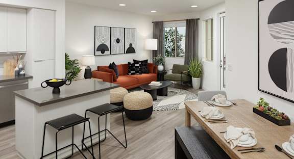 A modern kitchen and dining area with a pool table.