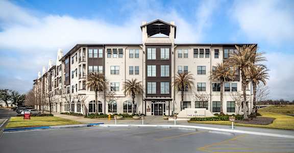 A large building with a sign that says  at The Addison, Baton Rouge, LA