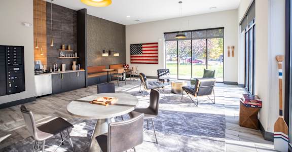 A modern dining room with a round table and chairs at Walnut View Apartments, Allentown, PA, 18102