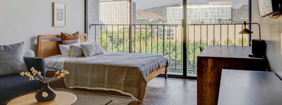 a bedroom with a bed and a window
