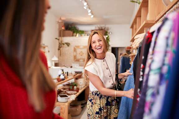 A woman is shopping in a clothing store.