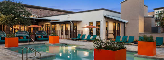 A modern house with a pool in the backyard.