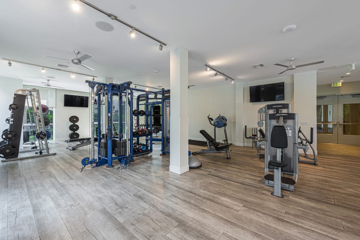 Riverhouse at 11th Apartments gym with cardio and weights - Miami, FL