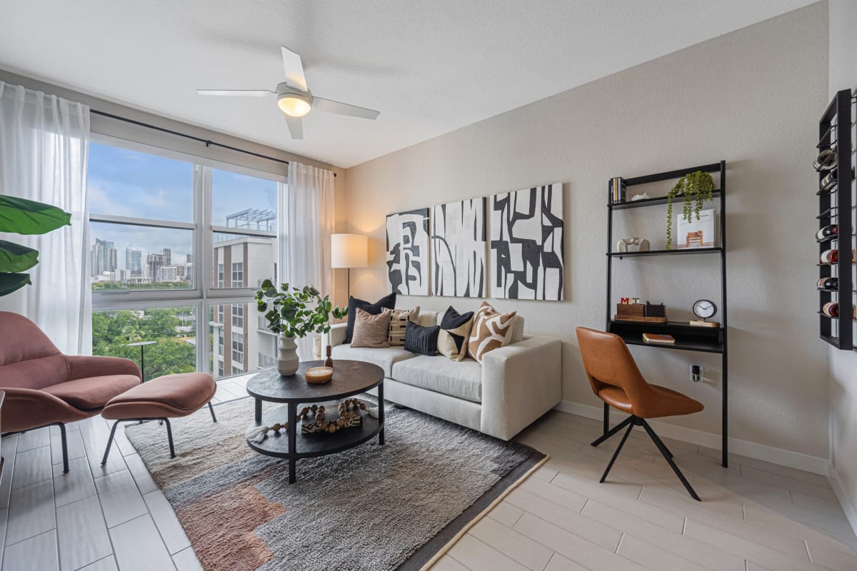 Riverhouse at 11th Apartments living room with large windows - Miami, FL