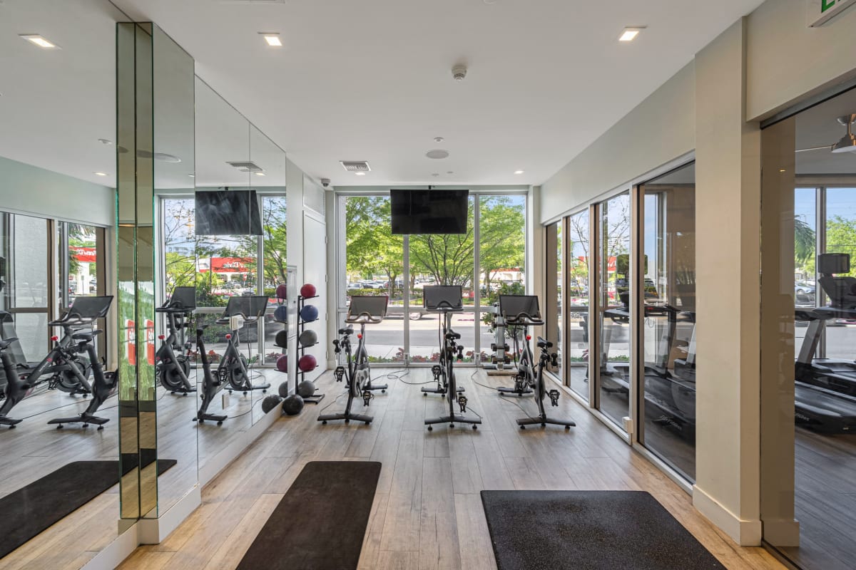Riverhouse at 11th Apartments fitness room with equipment - Miami, FL