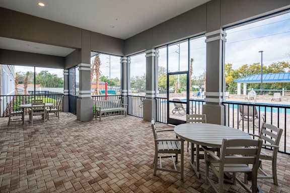 A patio with a table and chairs is shown.