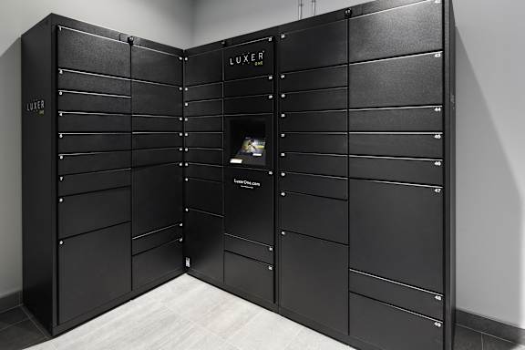 a large set of black lockers in a room