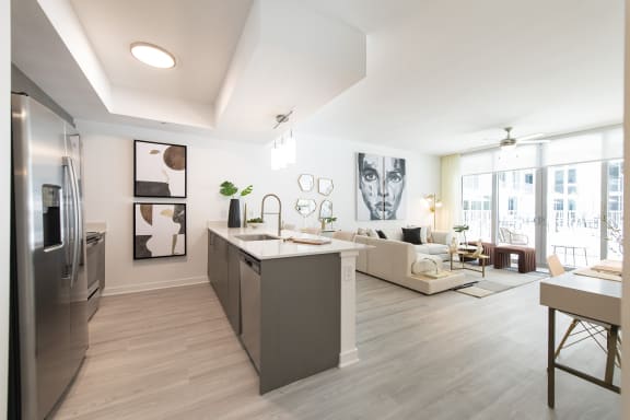 a kitchen and living room in a 555 waverly unit