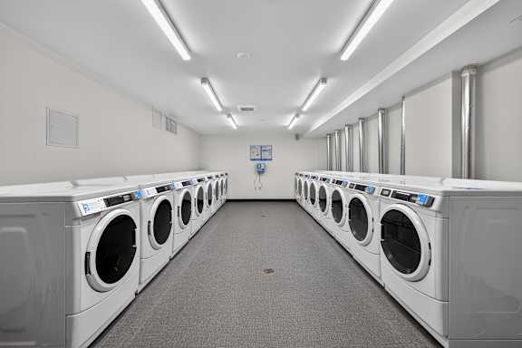A row of washing machines in a laundromat.