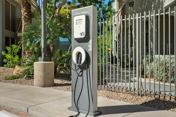 A grey charging station with the word Blink on it.