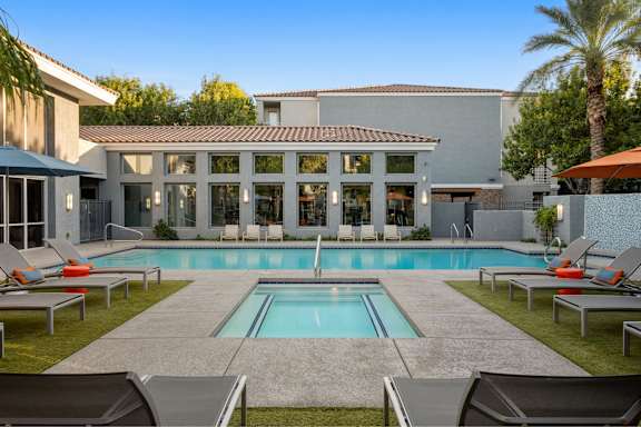 A modern house with a pool in the backyard.