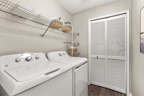 A white washer and dryer in a laundry room.