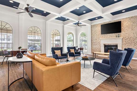 A living room with a fireplace and a television.