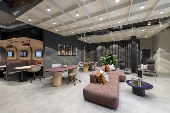 the lobby of an office space with couches and chairs