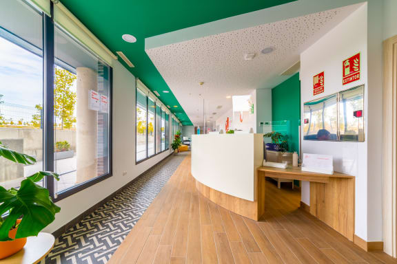 a reception area with green ceilings and white walls