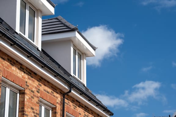 a close up of a home with a chimney