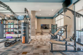 a workout room with weights and other exercise equipment